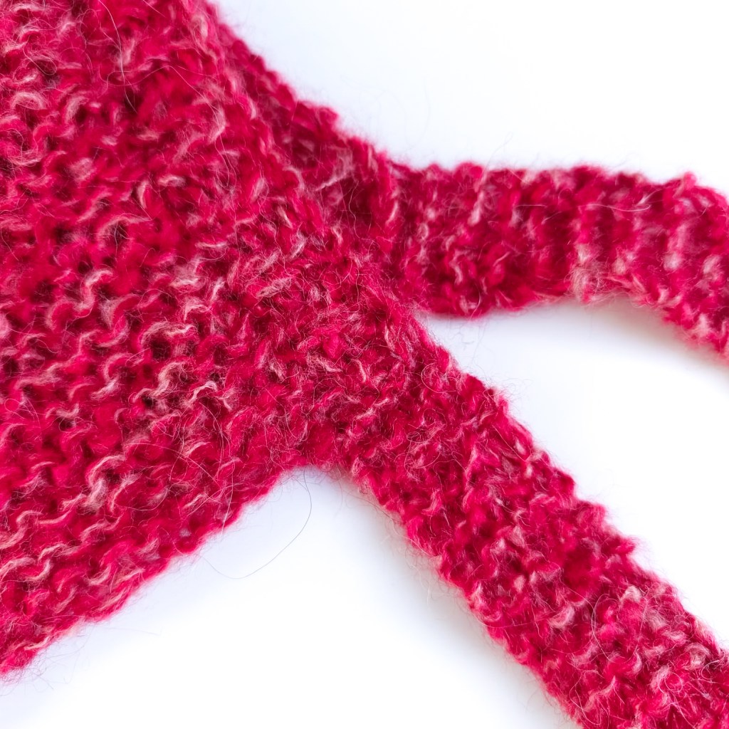 Chunky garter stitch mohair bonnet with long ties – free seamless knitting pattern for adults